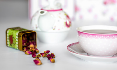 A cup of tea with dried roses