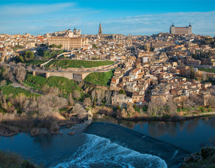 Toledo in morning light withe the Alcazar castle and cathedral over the Tajo river.