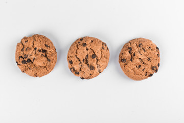 Three oatmeal cookies isolated on white