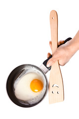 a pan in hands on a white background