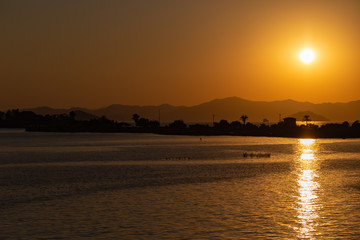 Naklejka premium Sunset on the Calis Beach on the Aegean Sea