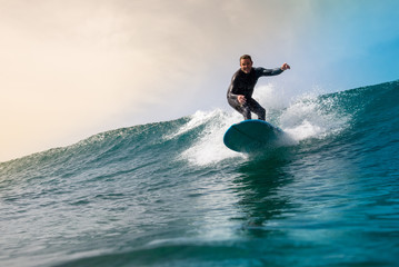 Surfer riding waves on the island of fuerteventura