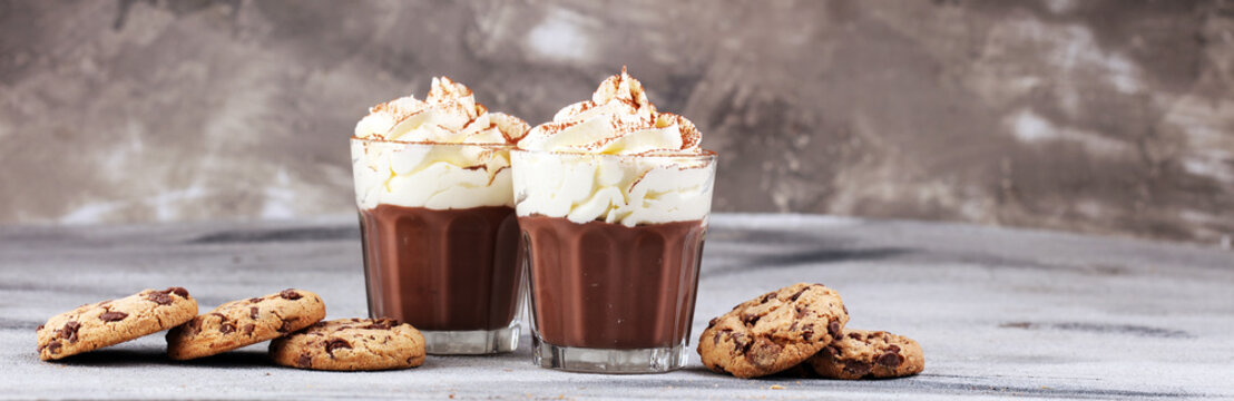 hot chocolate with cocoa and chocolate chip cookies and whipped cream
