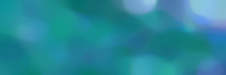 blurred bokeh iridescent landscape format background graphic with dark cyan, sky blue and steel blue colors space for text or image