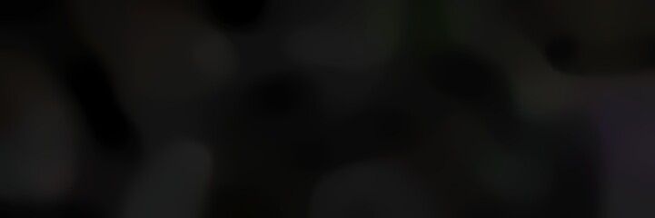 blurred bokeh landscape format background texture with very dark green, black and very dark blue colors and space for text