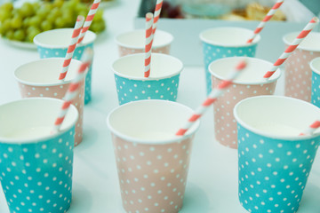 
Paper cups with paper tubes for the holiday standing on the table