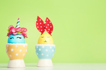 Cute easter eggs on green background