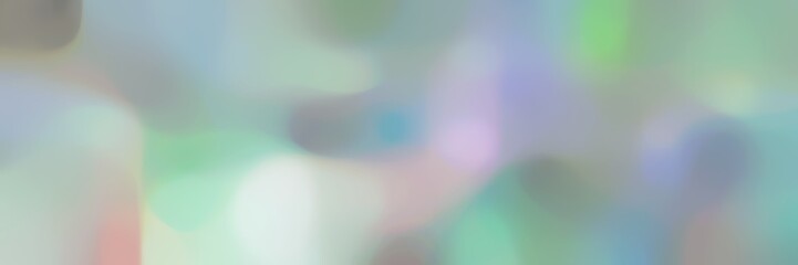 blurred bokeh iridescent landscape format background bokeh graphic with dark gray, light gray and silver colors space for text or image