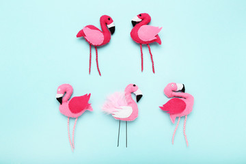 Soft toy of flamingos on blue background