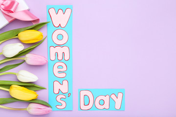 Text Womens Day with tulip flowers on purple background