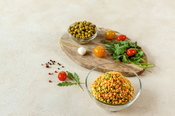 chopped dry peas, a mixture of legumes with fresh herbs, cherry tomatoes and canned peas on a...