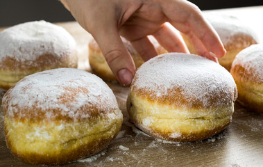 The buyer buys a donut from the counter.