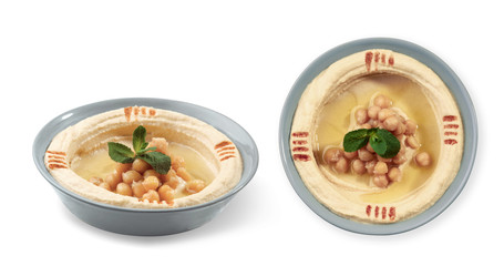 Top and side view of Hummus plate isolated on white background
