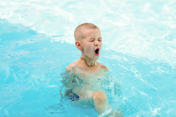 Fototapeta na wymiar boy screaming in the swimming pool