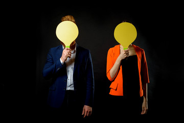 smiling handsome business man and business woman play tennis.. Without face.Sport and business. warm up and exercise at work in office. concept of success and achievement.