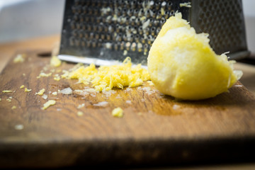 Removing the zest from the lemon. an ingredient for delicious dishes.