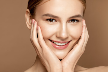Skin care model. Close up portrait of beautiful young woman with perfect skin posing. Beauty treatment and spa concept.