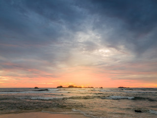 Fototapeta na wymiar Beautiful landscape of sunset sky over the cliffs in ocean