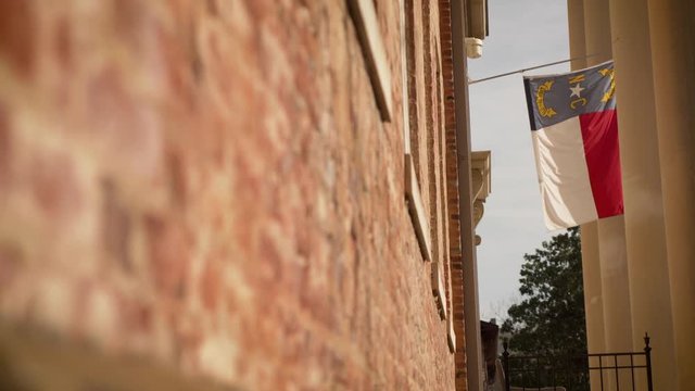 North Carolina state flag on beautiful building