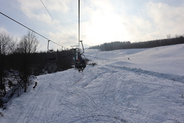 people enjoy outdoor activities in the mountains, skiing and snowboarding
