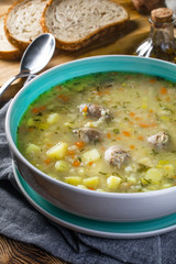 Polish barley soup with vegetables and chicken heart.