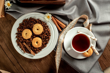 A cup of tea and sugar cookies. Top view