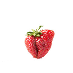 Ugly strawberry on white background