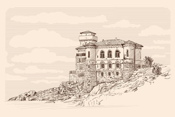 Medieval stone castle with towers on the rocks by the sea. © migfoto