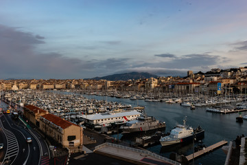 Obraz premium Marseille, France - January 25, 2020: the view of the old port (Vieux Port) at sunset