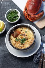  CHILEAN FOOD.  Baked crabmeat crab meat with cheese, cream and bread.  Traditional dish of chilean coast. Pastel o chupe de jaiba.