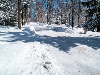 county road in winter wonderland the day after the snow storm