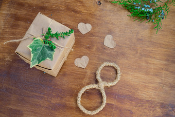 Happy Women's Day. Background for Women's Day. Greeting card international women's day March 8. box of Kraft paper and the number eight lie on a wooden background