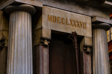 A grim crypt cut by the date at the old town (Stockholm); Facade with old architecture near the...