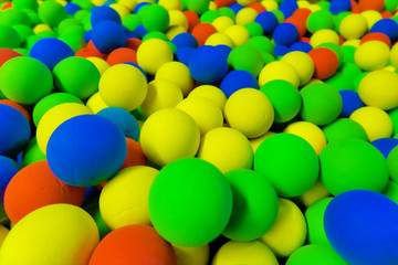Fototapeta na wymiar red, green , yellow and blue balls in the pit
