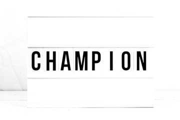 Champion flat lay on a white background.  Motivational. Success. Retro