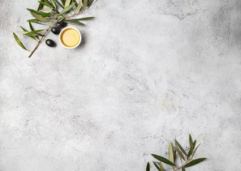 Fotobehang Food background with linen napkin, olive tree branch, olive oil on concrete background © lblinova