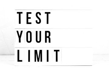 Test Your Limit flat lay. Motivational business start up board
