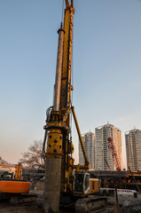 Contractors used bore pile rig machine at the construction site with building foundation work.