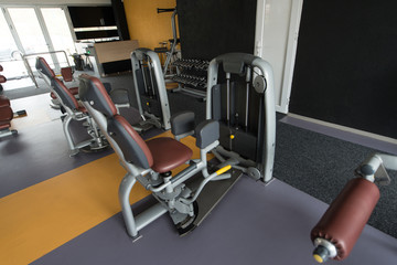 Fototapeta na wymiar Exercise Machines In A Modern Gym
