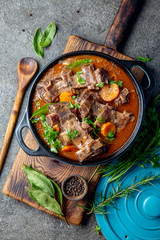 Beef ribs Bourguignon. Beef ribs stewed with carrot, onion in red wine. France dish