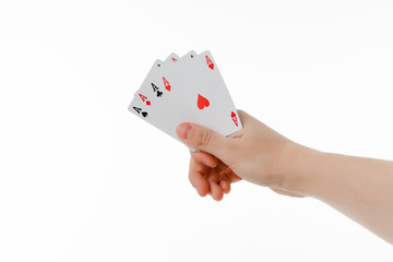 Playing cards in hand isolated on a white background