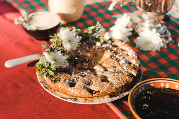 Berry pie decorated with flowers, tea party