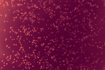 dark red background with round circles confetti