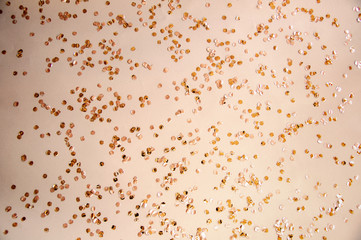 beige background with round circles confetti