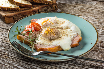 Fried eggs with pork ham.