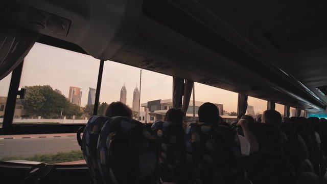 Tourist bus with tourists in Dubai.