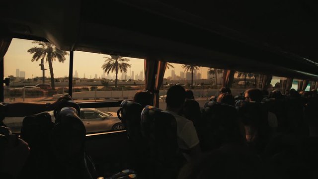 Tourist bus with tourists in Dubai.