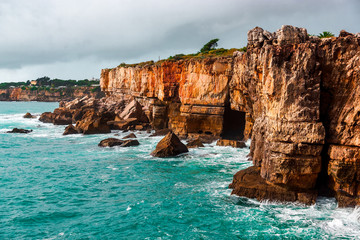 Rocky cave and Atlantic Ocean coastline. Amazing view at Boca do Inferno, Hell's Mouth &ndash; Cascais, Portugal