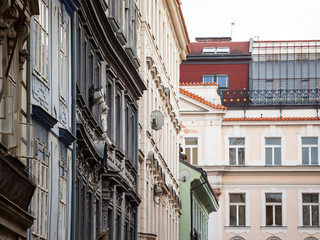 Typical Austro-Hungarian Facade of a baroque appartment residential building in a street of old town, the historical center of Prague, Czech Republic, in the most touristic part of the city