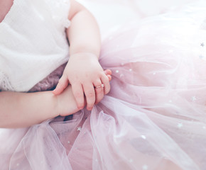 beautiful golden finger ring on the little hands of adorable toddler princess girl
